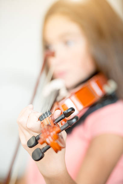 istock teenage girl with viola 503949608
