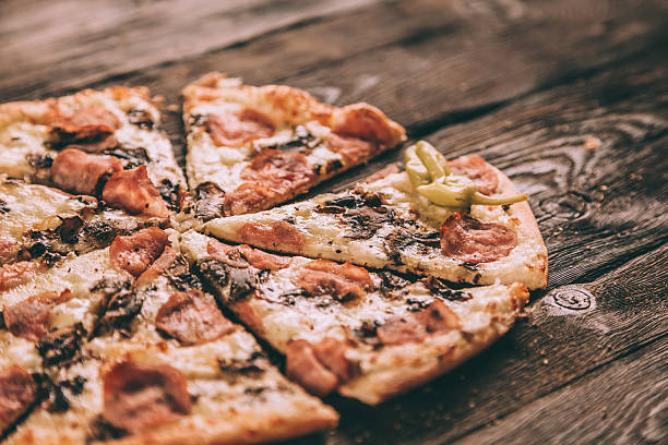 istock Homemade Pizza Slices with ham and mushrooms 503950118