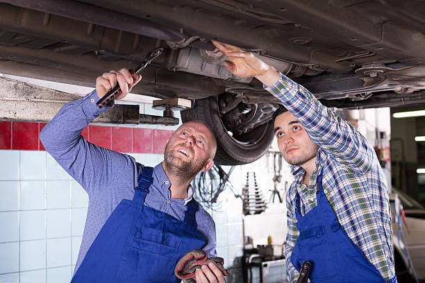 istock Professional mechanics repairing car 503951656