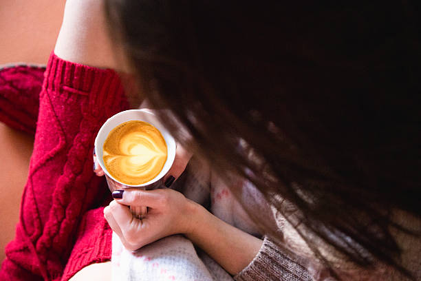 Girl in bed with coffee cup