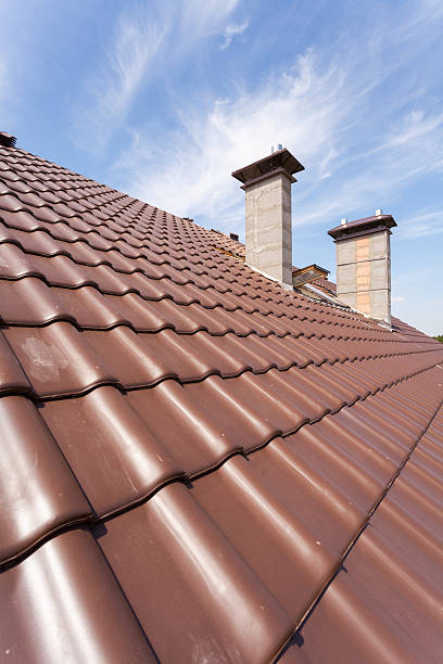 istock New red tiled Roof with chimneys 503953040