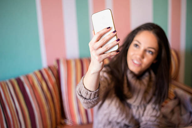 istock Girl in bed posing for self portrait 503953420