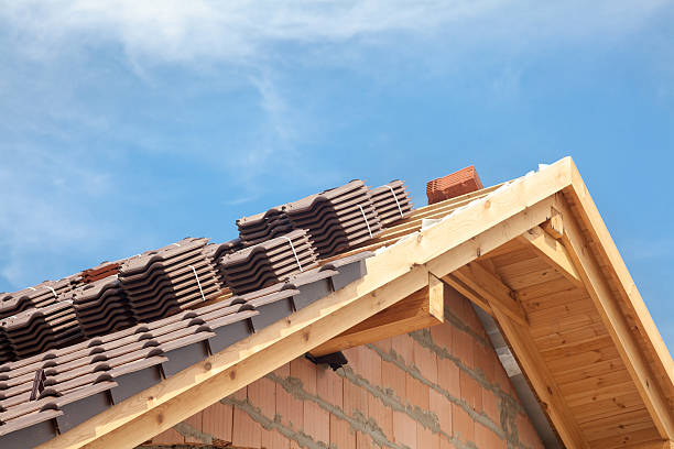 House under construction. Roofing tiles preparing to Install House under construction. Roofing tiles preparing to Install slate ridge stock pictures, royalty-free photos & images