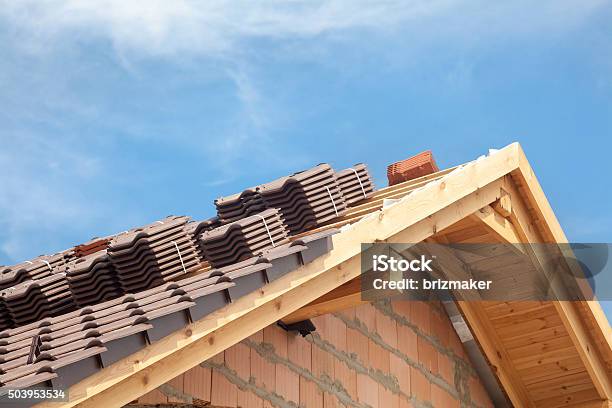 House Under Construction Roofing Tiles Preparing To Install Stock Photo - Download Image Now