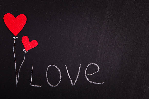 istock two red paper hearts on a blackboard  Valentine's Day 503954200