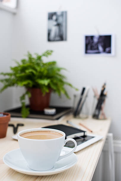 istock Cup of coffe in modern loft-style office 503954434