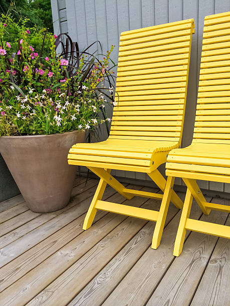 istock Patio decorated with yellow chairs and flowers 503954716