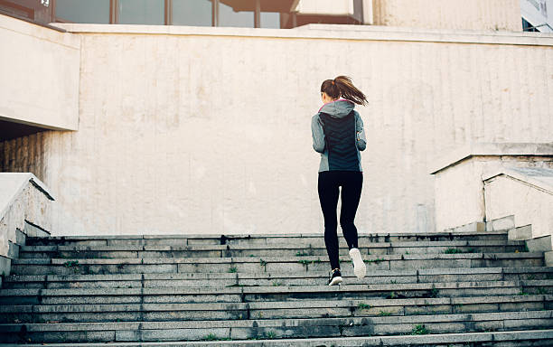 istock Woman Climbing Up The Stairs 503955794