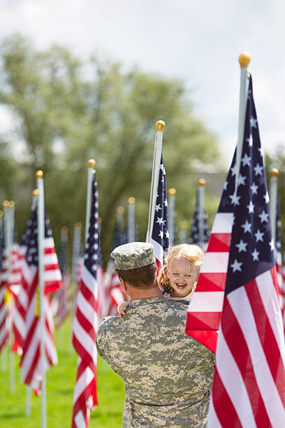 istock Toddler girl hugging her dad in uniform 503956784