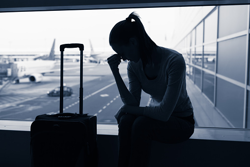 Stressed woman in airport.