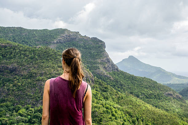 istock Young slim woman looking over the mountains 503958724