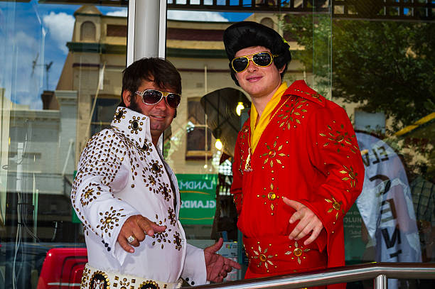 Parkes, NSW, Australia - January 6, 2016: 3 Elvis Impersonators posing at Parkes Elvis Festival in front of the Elvis Central head office\t