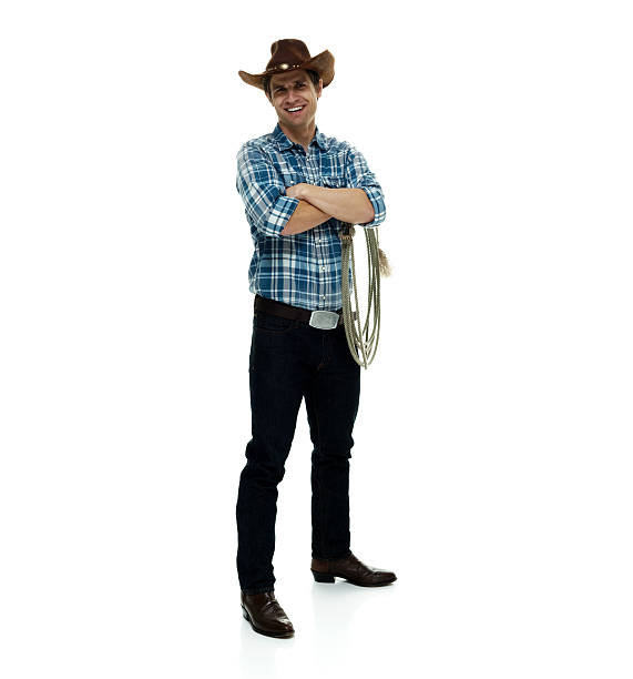 istock Smiling cowboy standing with arms crossed 503960162