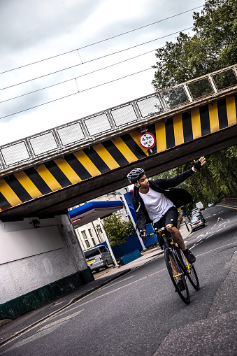 Cyclist in Central London, while commuting to work in the morning.