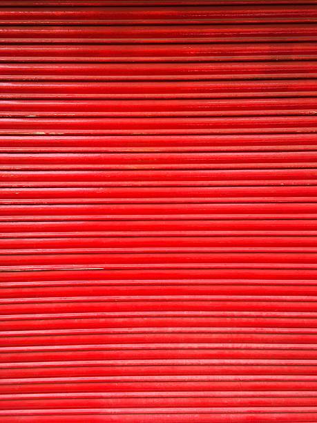 istock red metal roll door background 503961154