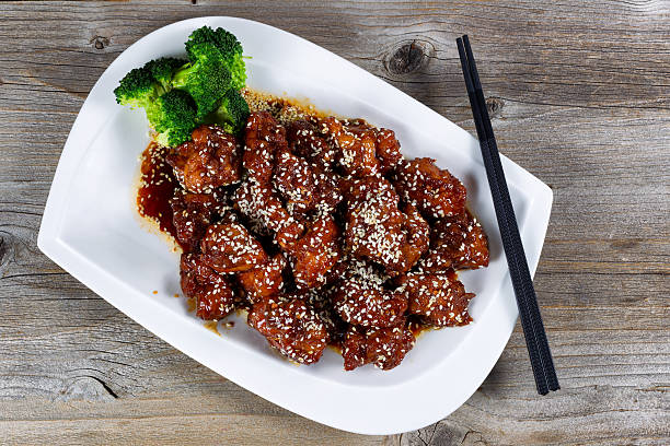 Sesame chicken with vegetables ready to eat stock photo