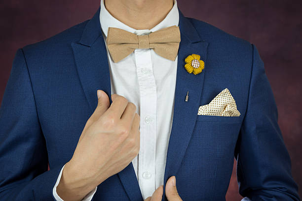 istock man in blue suit bowtie, brooch, handkerchief 503979924