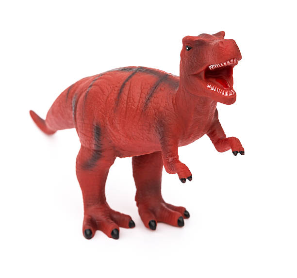istock red tyrannosaurus toy on a white background 503980680