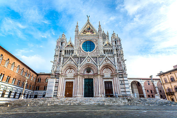 istock Siena cathedral against a bright blue sky in Italy 503981094