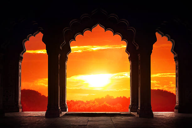 Arch silhouette at sunset Indian arch silhouette in old temple at dramatic orange sunset sky background. Free space for text mosque photos stock pictures, royalty-free photos & images