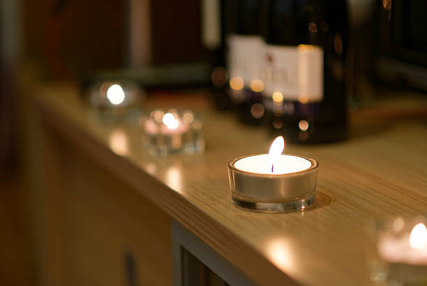 istock Candles and blurred bottles of wine 503981930