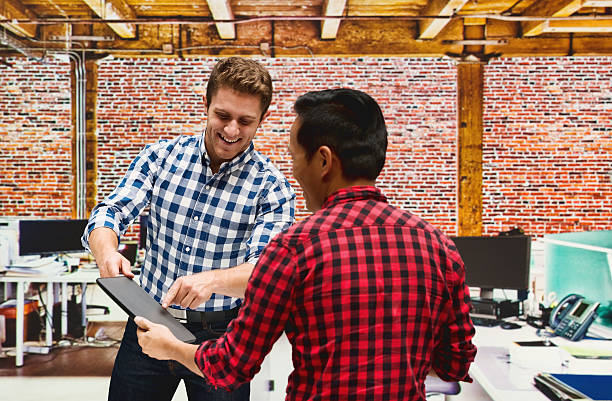 istock Smiling businessman discussion with client 503982416