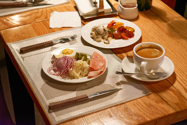 istock Served dinner in restaurant with two dishes and coffee 503982502