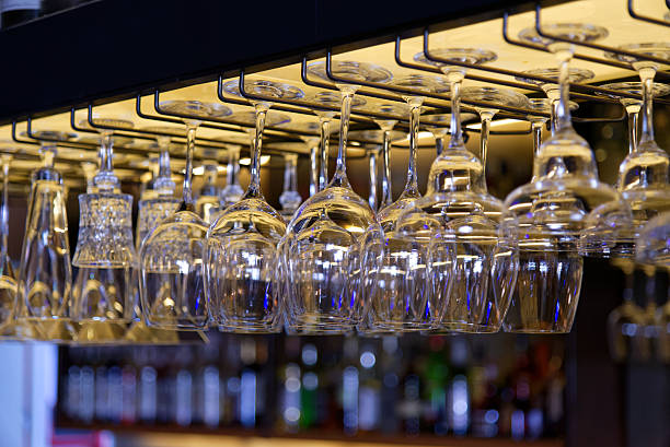 istock Group of empty wine glasses hanging  in a bar 503982828
