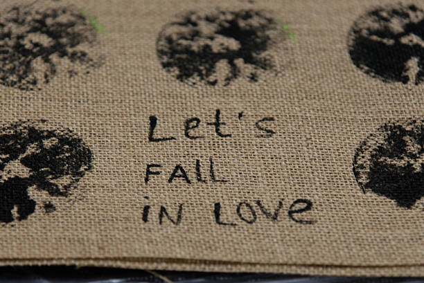 words let's fall in love drawn on a napkin