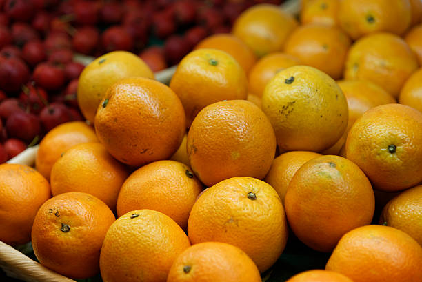 istock Many oranges on a market shelf 503983484