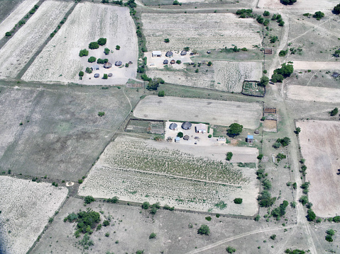 Aerial view of traditional huts and subsistence farming in Zimbabwe, Africa.