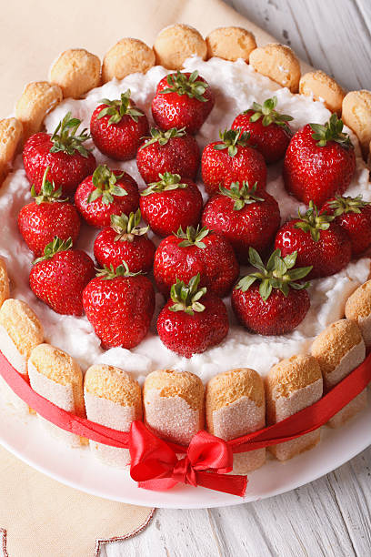 istock French Strawberry charlotte close-up on the table. vertical 503988578