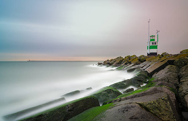 Storm clouds over a dam in the IJsselmeer during a springtime day along the IJsselmeer lakeshore.