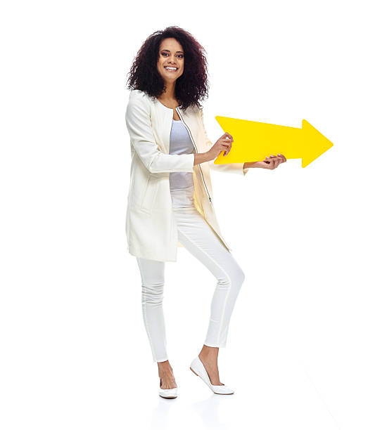 istock Cheerful woman holding an arrow 503990354