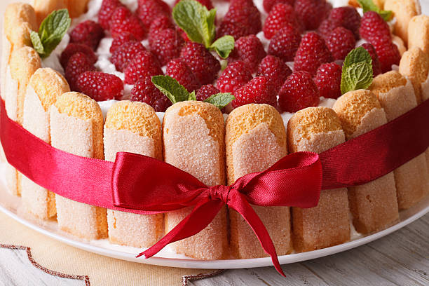 istock Beautiful raspberry charlotte cake on a plate close-up. horizont 503990700