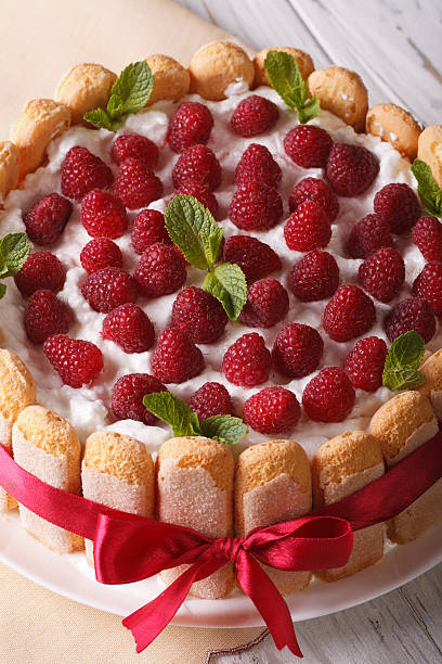 istock raspberry cake with mascarpone and Savoiardi close-up. vertical 503991258