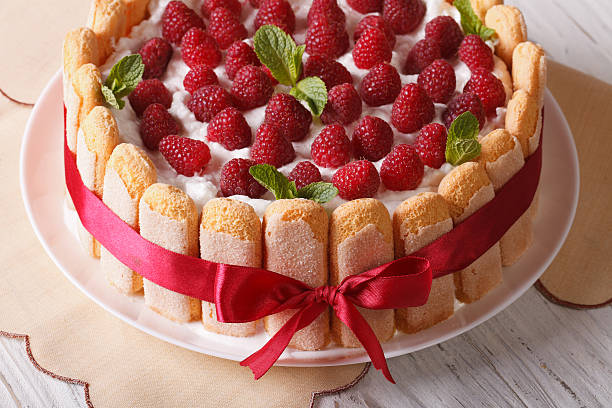 Beautiful raspberry tiramisu with Savoiardi close-up. horizontal