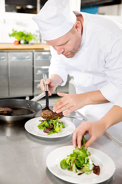 istock Professional chef prepare steak dish at restaurant 503991702