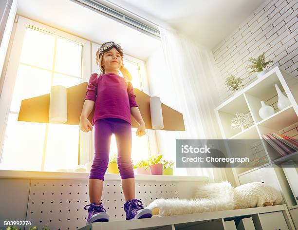 Child Plays In An Astronaut Costume Stock Photo - Download Image Now - Girls, Child, Explorer