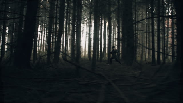 Terrified woman running in the forest