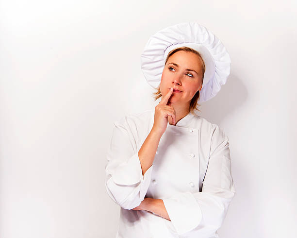 istock Woman chef look up and thinking. 504007964