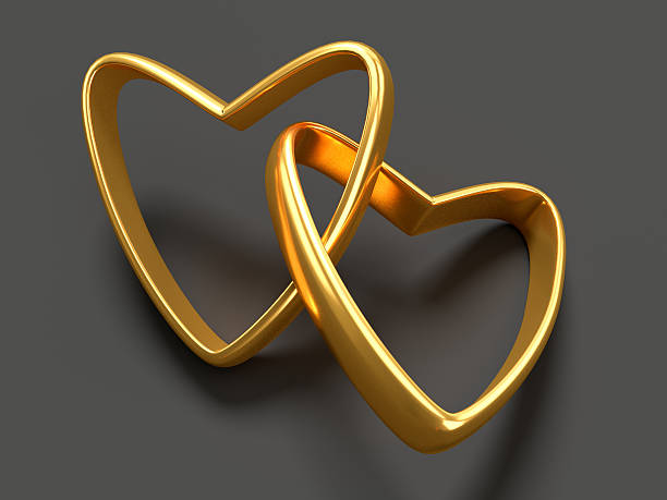 istock Two gold hearts rings 504008940