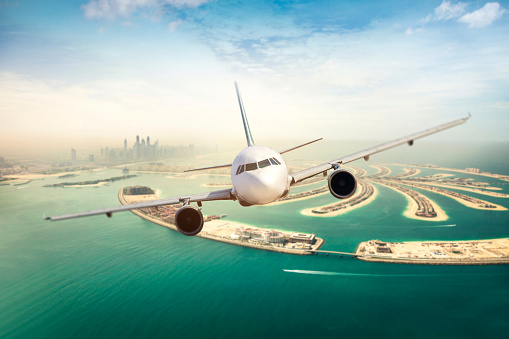 Air travel, a commercial plane flying over Dubai