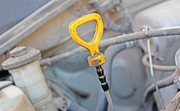 istock The oil dipstick of a car engine 504010112