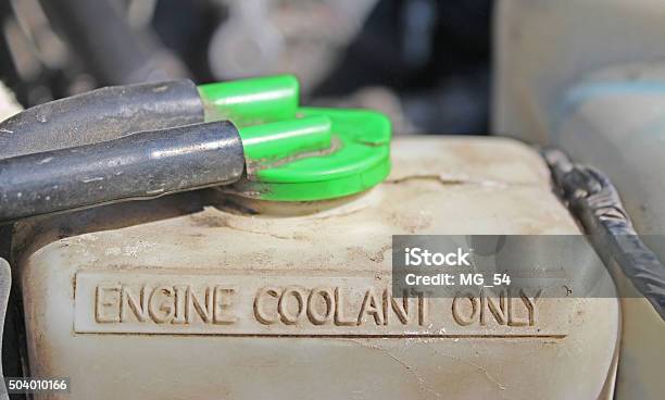 Coolant Reservoir Under The Hood Of A Car Stock Photo - Download Image Now - Car, Coolant, Engine