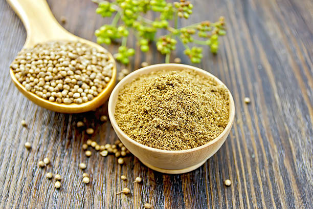 istock Coriander in bowl and spoon on dark board 504010448