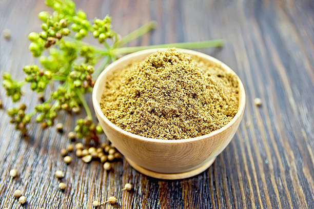 istock Coriander powder in bowl on board 504010464