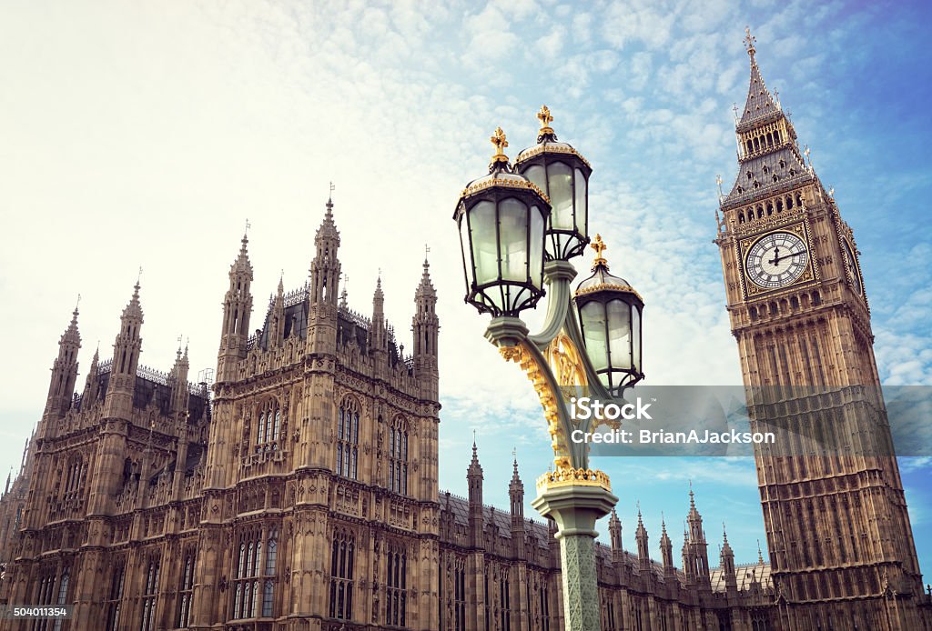 Big Ben and the houses of parliament in London Big Ben in London with the houses of parliament and ornate street lamp Government Stock Photo
