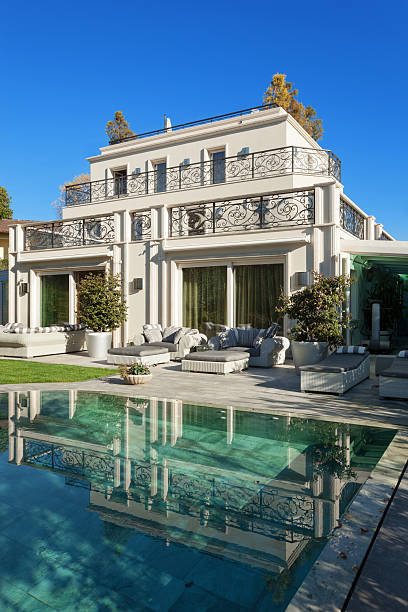 istock beautiful house with pool 504012494