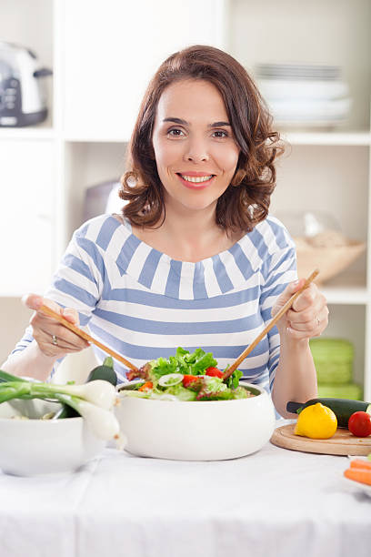 istock Woman Mixing Salad 504012906